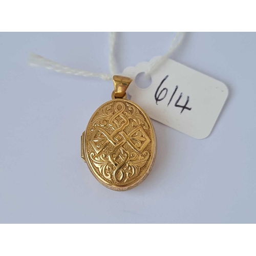 614 - A engraved oval locket pendant 9ct    1.6 gms