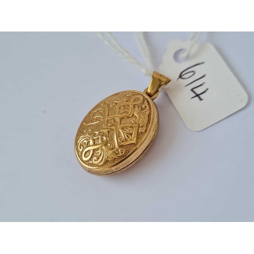 614 - A engraved oval locket pendant 9ct    1.6 gms