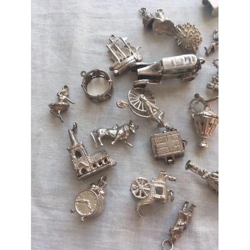 639 - A bag of numerous silver charms    140 gms