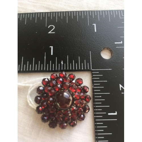 655 - A 19th century circular garnet brooch