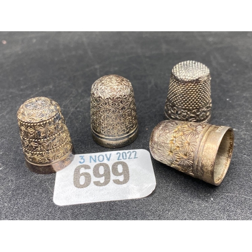 699 - A group of four thimbles, one Chester 1895, the others plated?