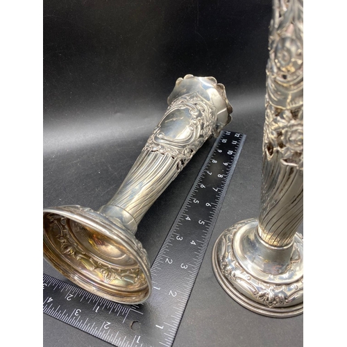 710 - A large pair of spill vases with pierced embossed V shaped stems, 10