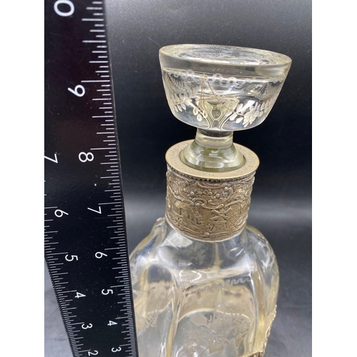 767 - A decorative continental (800 standard) decanter and stopper with etched glass vase of flowers, 9.5