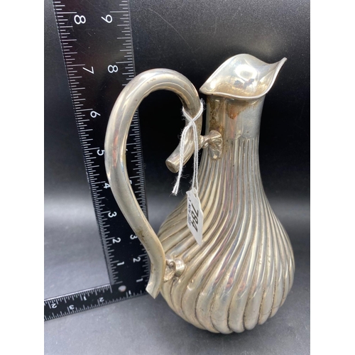 784 - A Bogota (900 standard) wine jug with swirl decoration, 8