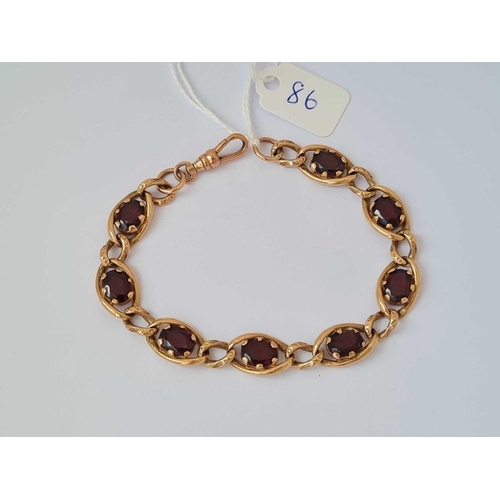 86 - A FANCY GARNET SET BRACELET 9CT   15.9 GMS