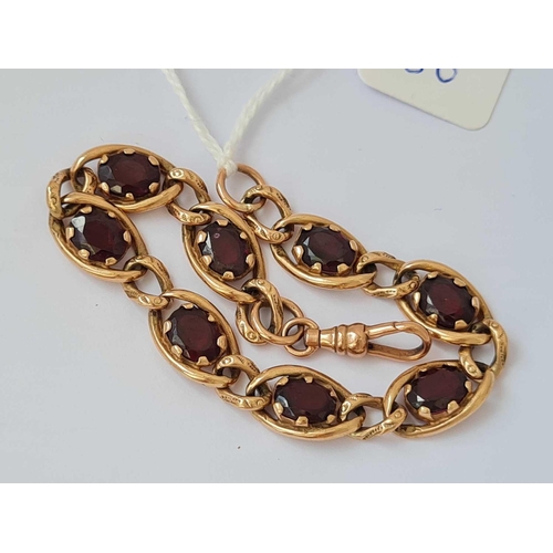 86 - A FANCY GARNET SET BRACELET 9CT   15.9 GMS