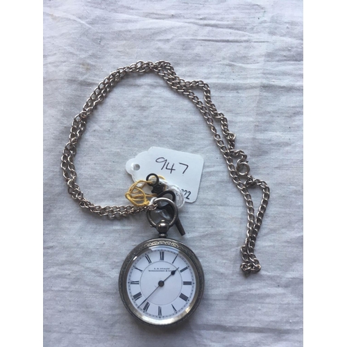 947 - A ladies silver fob watch on silver chain with key W/O