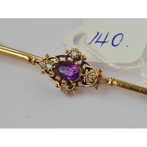 140 - A diamond and amethyst brooch 9ct   3 gms