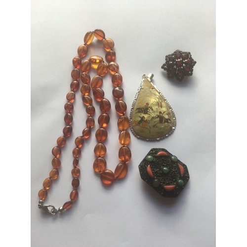 330 - A honey amber necklace, oriental pendant etc