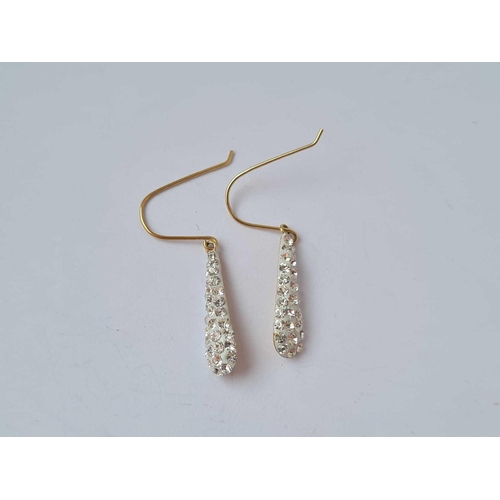 355 - A pair of gold white stone drop earrings