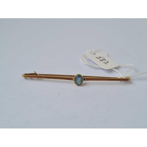 582 - A gold and blue stone brooch   2.6 gms