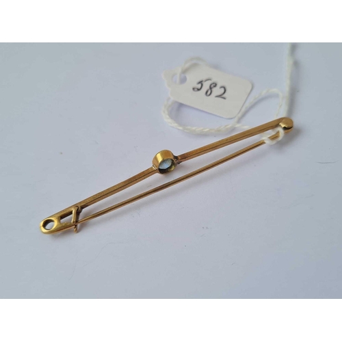 582 - A gold and blue stone brooch   2.6 gms