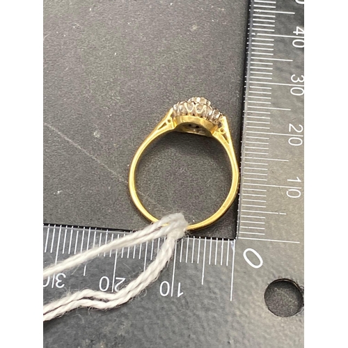 254 - A diamond cluster ring 18ct gold size O   3 gms