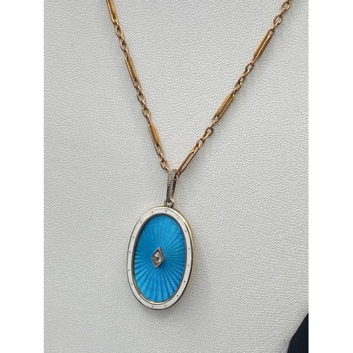 271 - A GOLD & DIAMOND OVAL AND BLUE ENAMEL LOCKET AND CHAIN