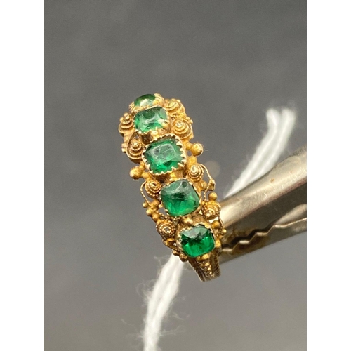 56 - A early Georgian high carat gold CANNETILLE work ring set with green stones size N