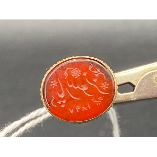 57 - A 19th century high carat gold eastern seal carnelian intaglio of flowers