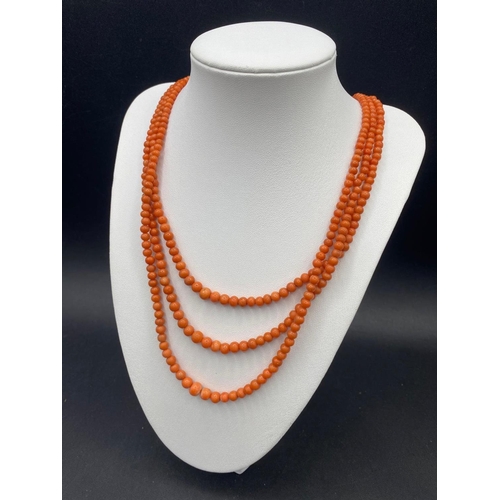 58 - A Victorian coral bead three strand necklace with original clasp