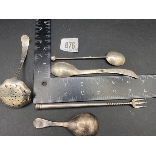 876 - A silver jubilee hall marked caddy spoon, Birmingham 1935, a sifter spoon and three other pieces