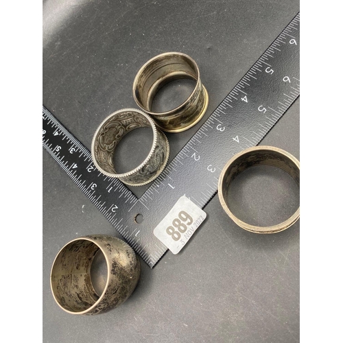 889 - An embossed napkin ring, Sheffield 1901 and three others, 88g