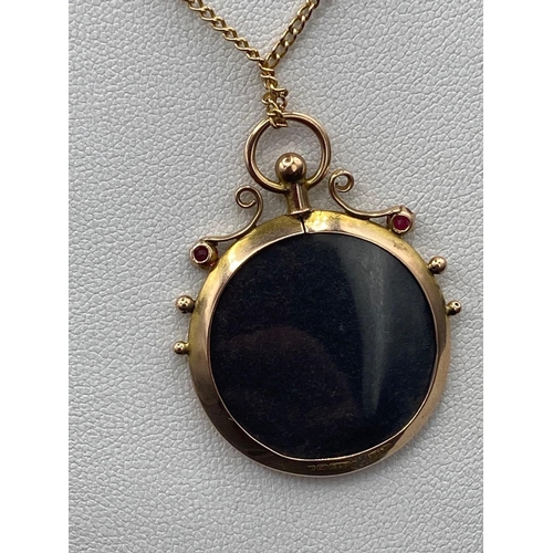 141 - Antique double sided 9ct glass locket on 9ct chain