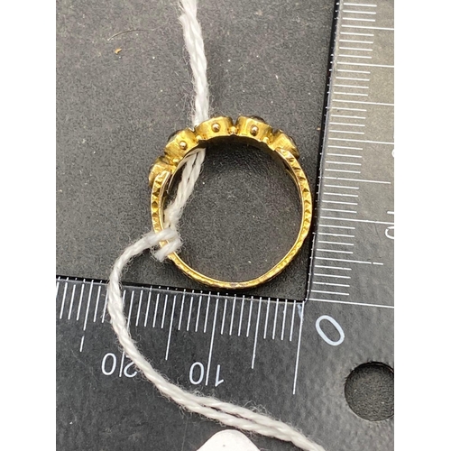 145 - An antique gilt metal 5 stone ring