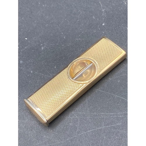 146 - A 9ct mounted cigar cutter 11g