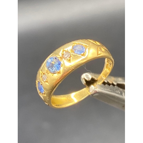 147 - A diamond & sapphire 18ct gold gypsy ring size K 2.8g inc