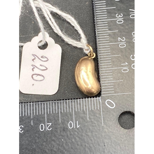 220 - A rose gold kidney bean charm 9ct