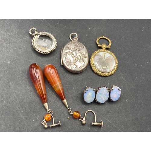 225 - A silver opal brooch, silver locket and other jewellery