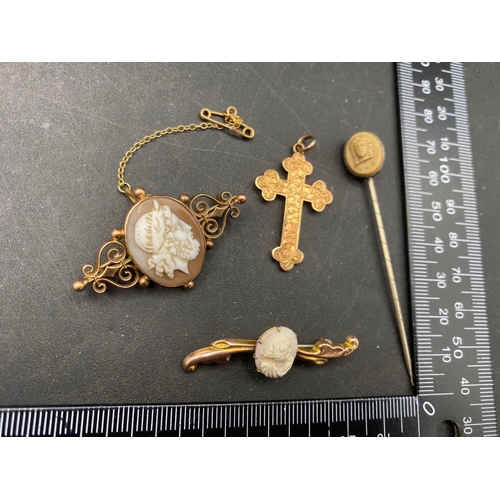 227 - An antique 9ct cross, 2 gold cameo brooches and a cameo stick pin