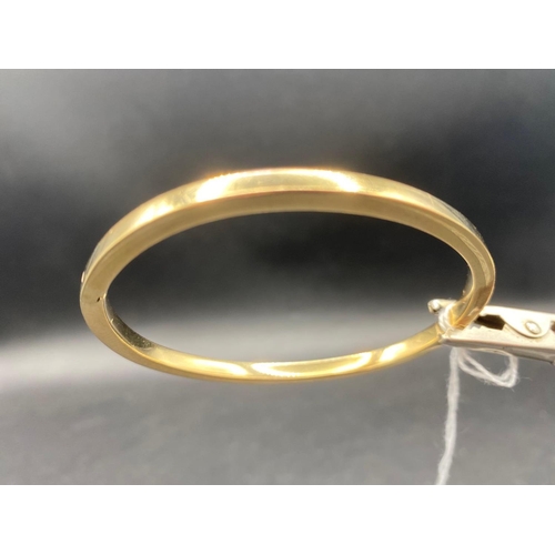 3 - A plain hinged 9ct bangle 9.6g