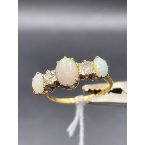 41 - A vintage 5 stone opal & diamond ring set in 18ct gold size T 4g inc