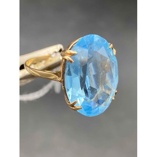 105 - A large 9ct gold blue stone dress ring size Q 5.2g inc