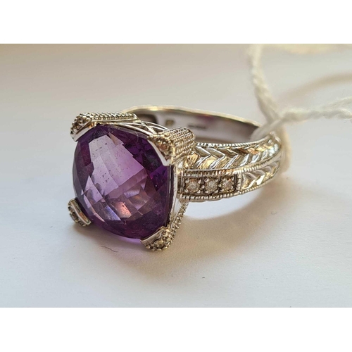 206 - A IMPRESSIVE WHITE GOLD RING WITH LARGE FACETED AMETHYST 1CM DIAMETER WITH 6 DIAMONDS TO SHOULDER AN... 