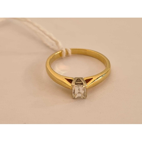 29 - A single stone diamond ring set with a Millennium cut rectangular diamond (0.37 ct) 18ct gold size J... 