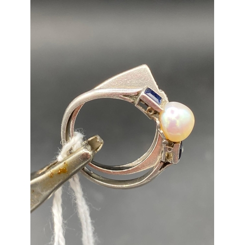 437 - A PLATINUM PEARL AND SAPPHIRE RING SIZE R   3.7 GMS TOGETHER WITH A THREE STONE WHITE GOLD DIAMOND R... 