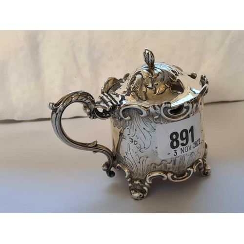 891 - A decorative Victorian mustard pot with applied scroll decoration, London 1840, 143g excluding BGL