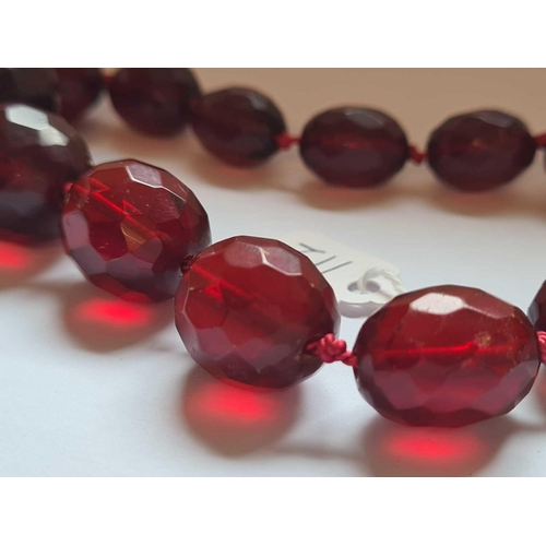 112 - A string of cherry amber beads 18 inch     59 gms