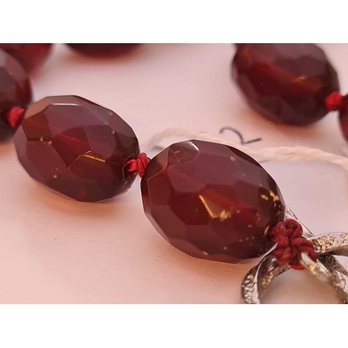 112 - A string of cherry amber beads 18 inch     59 gms