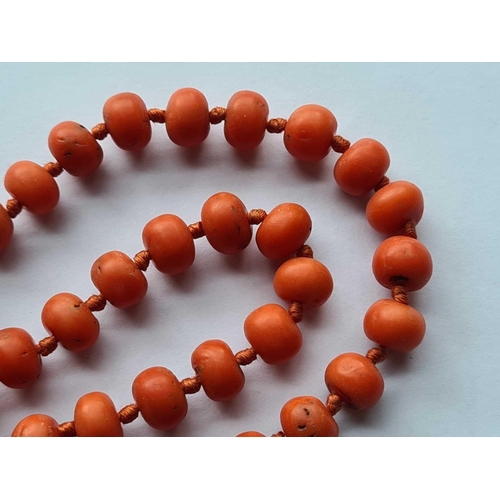 332 - A ANTIQUE STRING OF LARGE CORAL BEADS