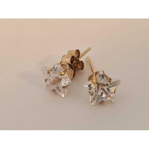 63 - Pair of white stone star shaped gold mounted studs