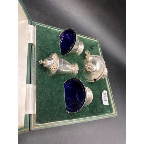 936 - An Art Deco style four piece cruet set in fitted box, Sheffield 1934 by R&B, 225g excluding BGL's