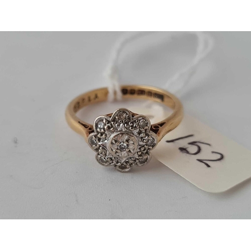 152 - A diamond flower head ring 18ct gold size L   3.4 gms