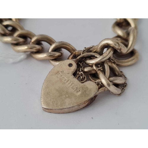 206 - A curb link silver bracelet with heart padlock clasp    38 gms