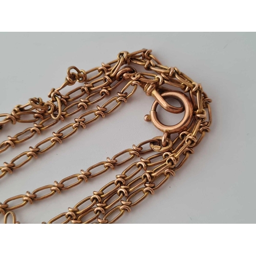 215 - A FANCY 9CT GUARD CHAIN 50 INCHES PLUS    25.5 GMS