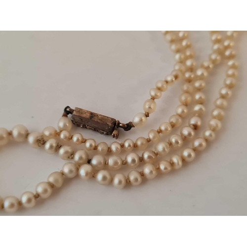 225 - A single row pearl necklace broken with gold and diamond set clasp