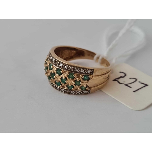 227 - A emerald and diamond gypsy set ring 14ct gold size M    3.4 gms