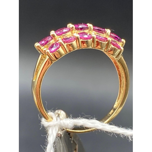 244 - A three row ruby dress ring 9ct Size P