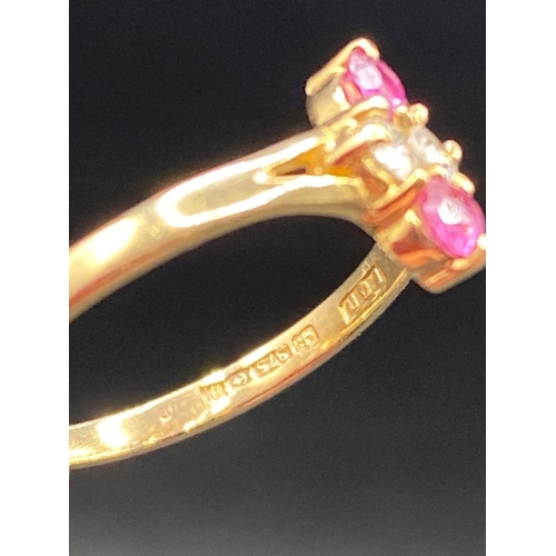 250 - A pretty ruby and diamond lozenge shaped ring 9ct Size H