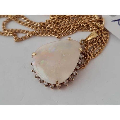 263 - A good large opal & diamond pendant in 14ct gold on 14ct chain 9g inc